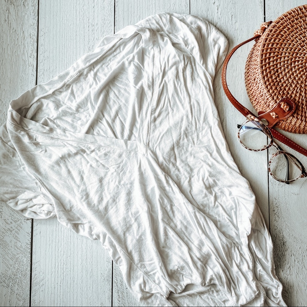 V-neck white body suit.